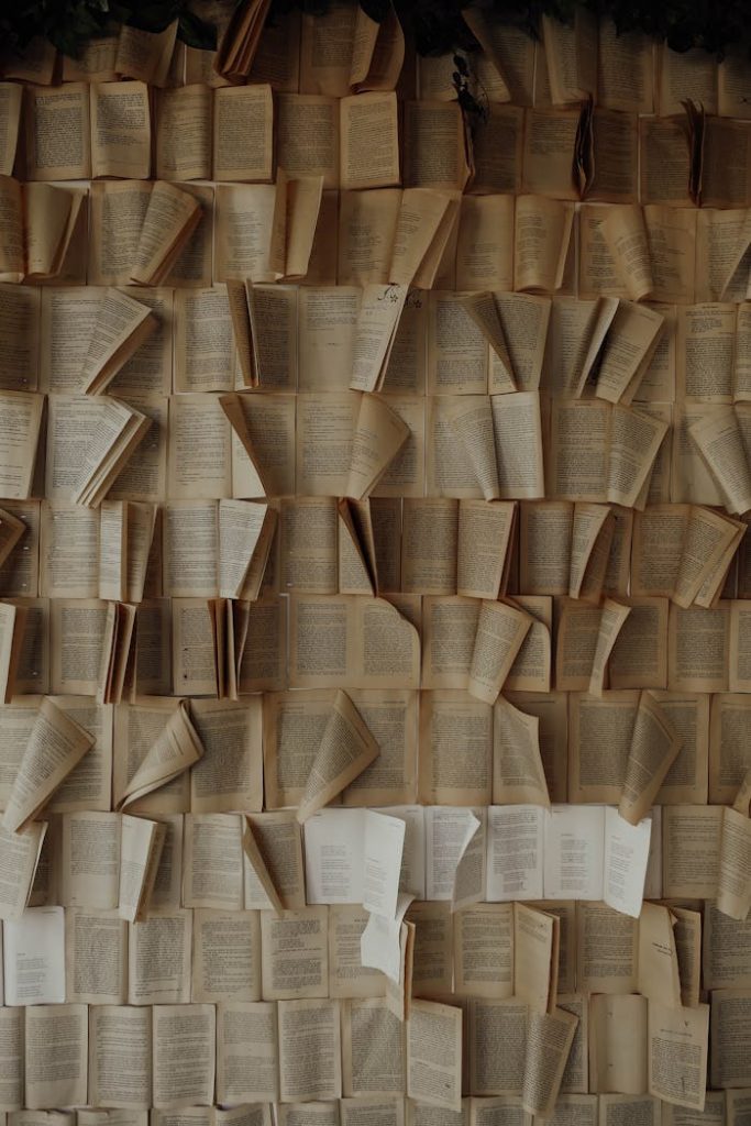 Mastering the First Impression: Your intriguing post title goes here A captivating display of old open books arranged vertically, creating a vintage aesthetic.